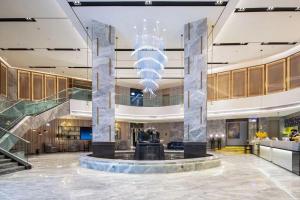 Vstupní hala nebo recepce v ubytování Echarm Hotel Wuzhou Wangcheng Plaza Longmu Temple Sanzongfu Branch