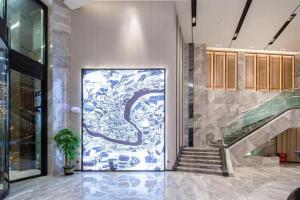 Fotografie z fotogalerie ubytování Echarm Hotel Wuzhou Wangcheng Plaza Longmu Temple Sanzongfu Branch v destinaci Wuzhou