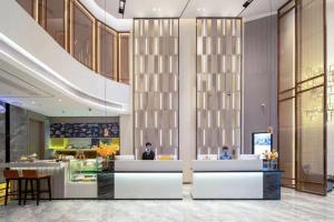 Posezení v ubytování Echarm Hotel Wuzhou Wangcheng Plaza Longmu Temple Sanzongfu Branch
