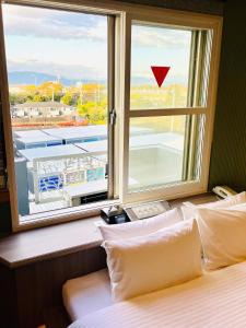 Krevet ili kreveti u jedinici u objektu 富士Outlet温泉Hotel