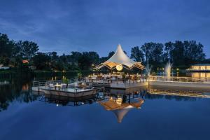 a wedding reception on the water at night at Banyan Tree Phuket in Bang Tao Beach