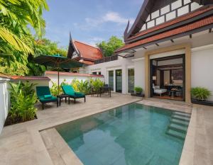a pool in the backyard of a villa at Banyan Tree Phuket in Bang Tao Beach