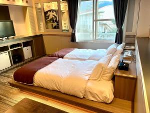 Krevet ili kreveti u jedinici u objektu 富士Outlet温泉Hotel