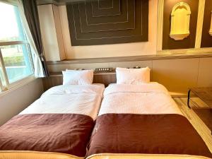 Krevet ili kreveti u jedinici u objektu 富士Outlet温泉Hotel