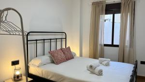 Posteľ alebo postele v izbe v ubytovaní Apartamento MMG