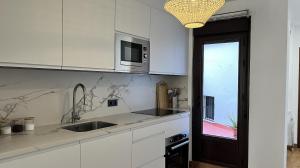 Kuchyňa alebo kuchynka v ubytovaní Apartamento MMG