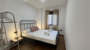Posteľ alebo postele v izbe v ubytovaní Apartamento MMG