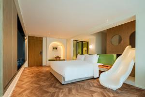 Postel nebo postele na pokoji v ubytování 汕头妈屿蓝MASULAND Sea View Hotel
