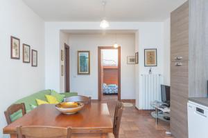 a living room with a table and a couch at Le Giare in La Maddalena