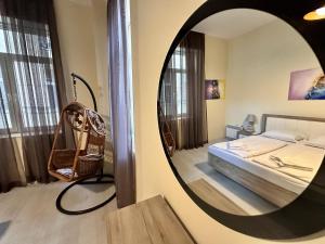 a mirror in a room with a bed and a bedroom at Prime Stays at 34 Bratya Miladinovi Street in Sofia