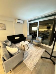 a living room with a couch and a table at Silverstone Downtown Center Long-Stay Home in Vancouver in Vancouver