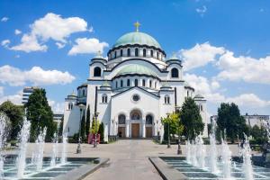 a large white church with a cross on top of it at Best choice Hram centar in Belgrade