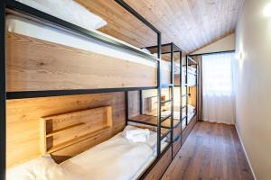 Postel nebo postele na pokoji v ubytování SWISSPEAK Resorts Thyon 4 Vallées