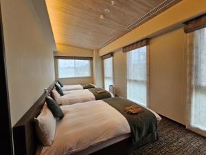 Postel nebo postele na pokoji v ubytování Hotel Grand Vert Kyu Karuizawa