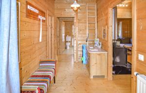 a hallway of a wooden cabin with benches and a ladder at Ferienhaus Donau 102 in Hayingen +11 photos