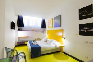 Un ou plusieurs lits dans un hébergement de l'établissement Correra 241 Lifestyle Hotel