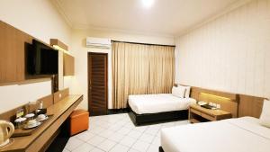 Voodi või voodid majutusasutuse MMUGM Hotel toas +13 fotot