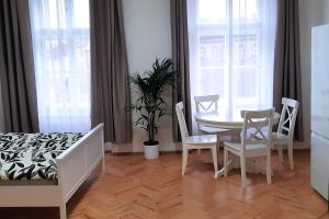 Posteľ alebo postele v izbe v ubytovaní Arbes apartman