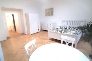 Posteľ alebo postele v izbe v ubytovaní Arbes apartman