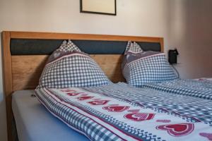 Postel nebo postele na pokoji v ubytování Apart Vinschgau