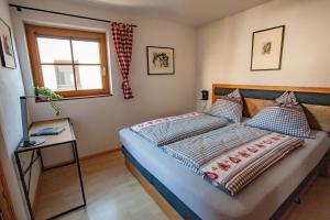 Postel nebo postele na pokoji v ubytování Apart Vinschgau