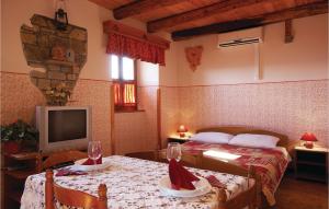 Postel nebo postele na pokoji v ubytování Holiday Home Frki V
