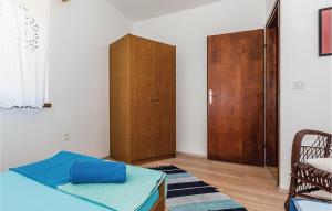 Ein Bett oder Betten in einem Zimmer der Unterkunft Four-Bedroom Holiday Home In Zaboric