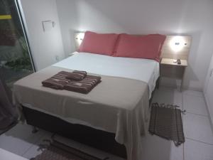 Postel nebo postele na pokoji v ubytování AYRE GOSTOSO POUSADA