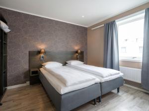 Postel nebo postele na pokoji v ubytování Comfort Hotel Finnsnes