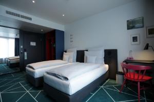 Postel nebo postele na pokoji v ubytování sander Hotel