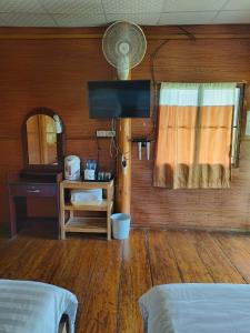 Postel nebo postele na pokoji v ubytování Baan Suan Mae Klang Luang