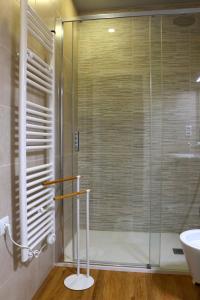 a bathroom with a glass shower and a sink at Casa Tia Etelvina in Castro Daire