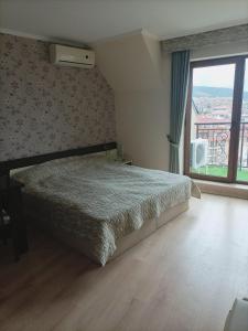 Postel nebo postele na pokoji v ubytování Studio w Hotel Grand