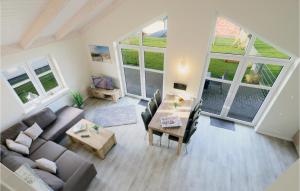 a living room with a couch and a table at Lovely Home In Dagebüll With Kitchen in Dagebüll