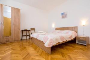 Ein Bett oder Betten in einem Zimmer der Unterkunft Apartment Andjelko G