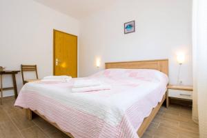 Ein Bett oder Betten in einem Zimmer der Unterkunft Apartment Andjelko G