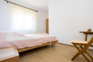 Ein Bett oder Betten in einem Zimmer der Unterkunft Apartment Andjelko G