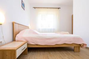 Ein Bett oder Betten in einem Zimmer der Unterkunft Apartment Andjelko G