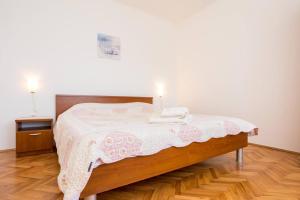 Ein Bett oder Betten in einem Zimmer der Unterkunft Apartment Andjelko G