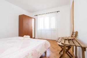Ein Bett oder Betten in einem Zimmer der Unterkunft Apartment Andjelko G