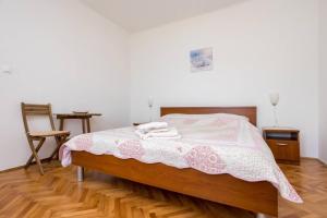 Ein Bett oder Betten in einem Zimmer der Unterkunft Apartment Andjelko G