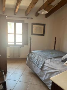 Posteľ alebo postele v izbe v ubytovaní Casa Es Mercat