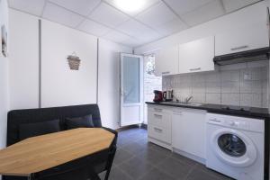 O bucătărie sau chicinetă la Appartement avec terrasse +6 fotografii