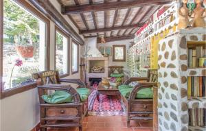 a living room with two chairs and a table at Three-Bedroom Holiday Home In Santagata Feltria Rn in SantʼAgata Feltria