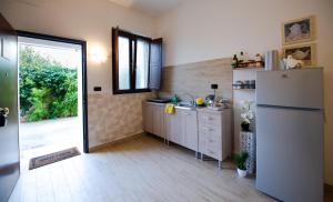 Η κουζίνα ή μικρή κουζίνα στο Intero alloggio, Binario 18 +17 φωτογραφίες