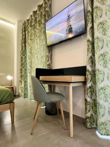 TV a/nebo společenská místnost v ubytování Alma Domus Feriae - Roma