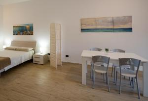 Ένα ή περισσότερα κρεβάτια σε δωμάτιο στο Intero alloggio, Binario 18