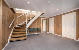 an empty hallway with a staircase in a house at Lovely Home In Sjusjøen With Sauna in Sjusjøen