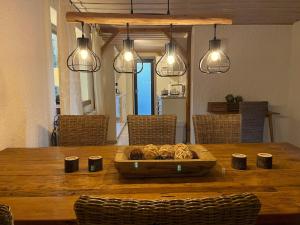 a table with a bowl of food on top of it at Montara Suites Bodenmais I aktivCARD Bayerischer Wald inklusive in Bodenmais