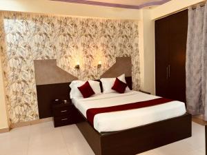 Postel nebo postele na pokoji v ubytování Hotel Chariot Inn Patna